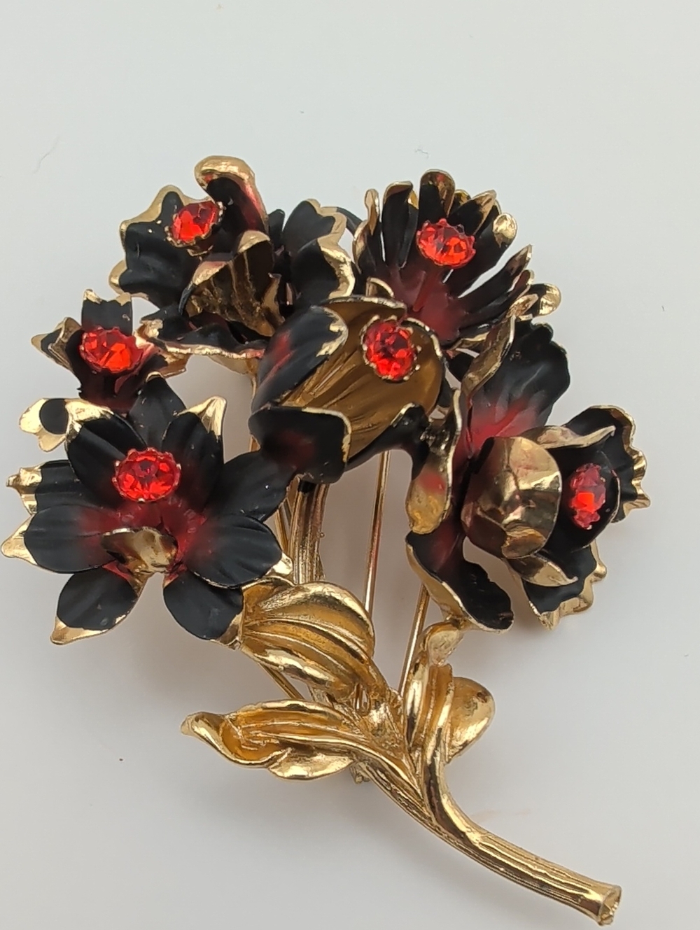 Large Vintage Austrian Floral Red Crystals Black Enameled Gold Brooch. Nearly 3"